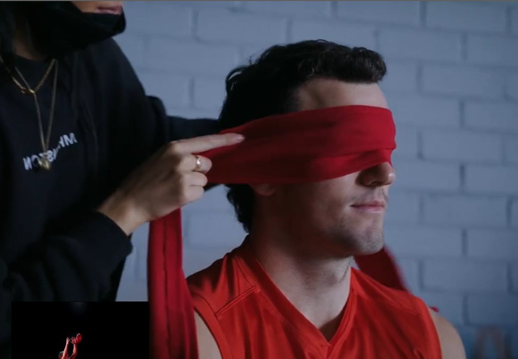 Sydney Swans player being blindfolded